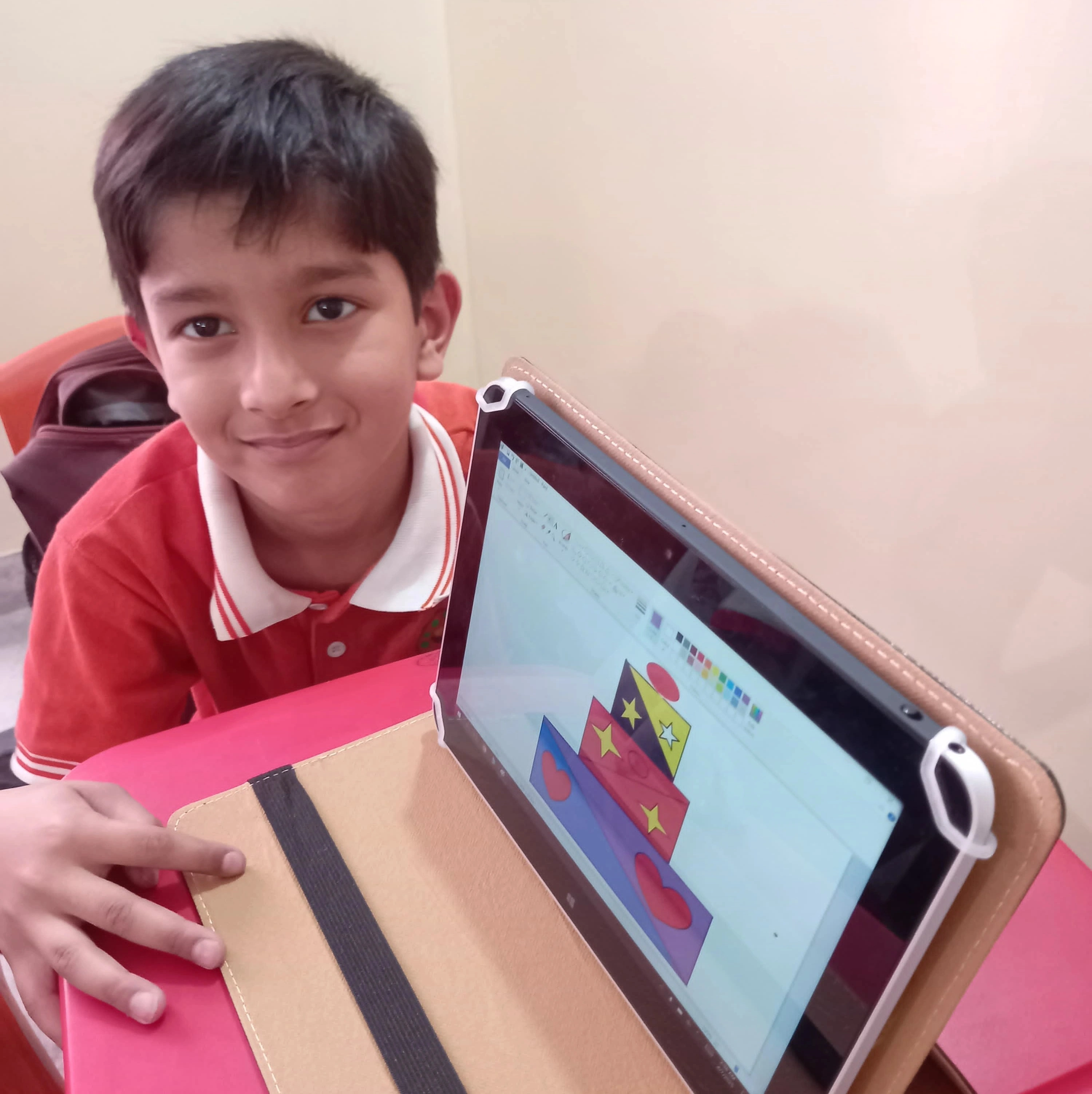 A young girl focused on her coding project