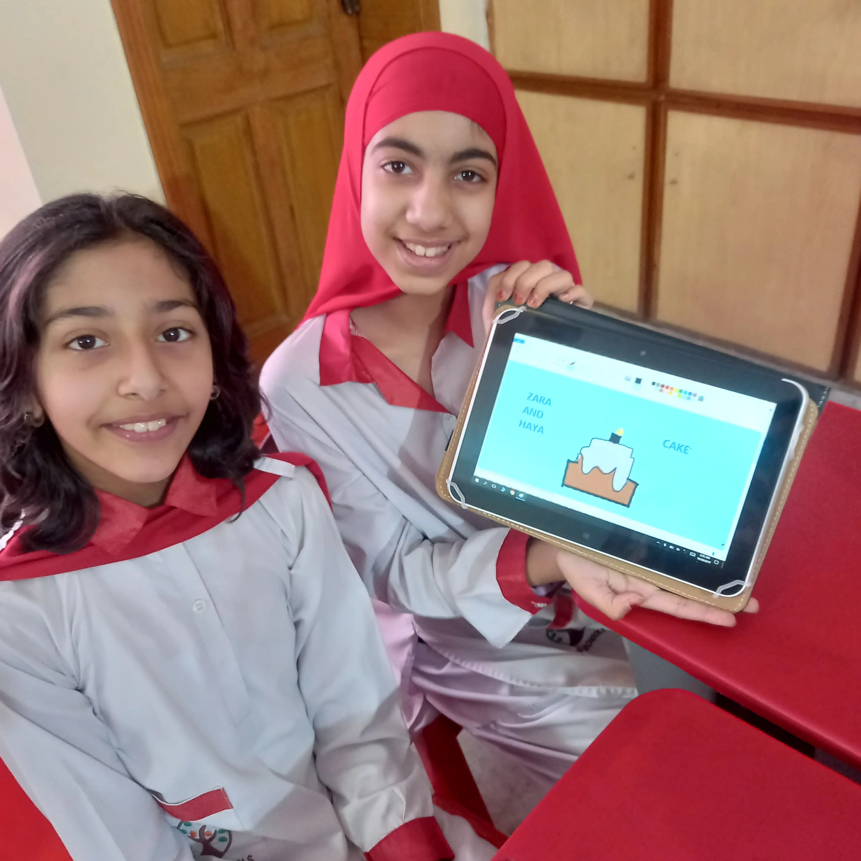 A classroom with students using laptops